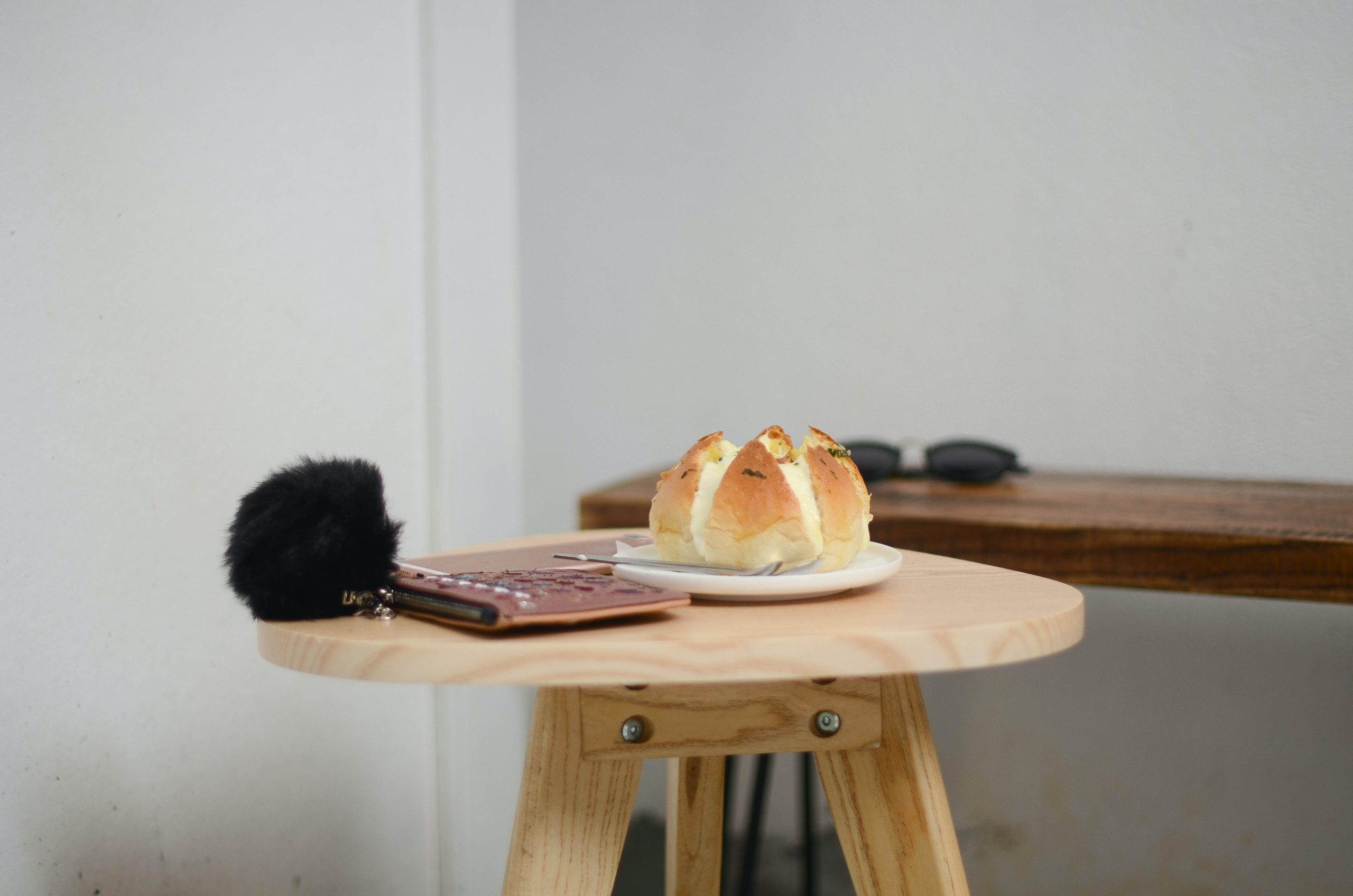 bread on white ceramic plate on brown wooden table